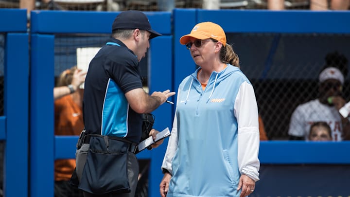 Jun 2, 2025; Oklahoma City, OK, USA;  Tennessee Lady Volunteers head coach Karen Weekly talks to the home plate umpire in the fourth inning against the Texas Longhorns during the NCAA Softball Women's College World Series semifinal game at Devon Park. Mandatory Credit: Brett Rojo-Imagn Images