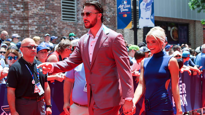 Jul 15, 2025; Atlanta, GA, USA; National League pitcher Paul Skenes (30) of the Pittsburgh Pirates and social media influencer Livvy Dunne