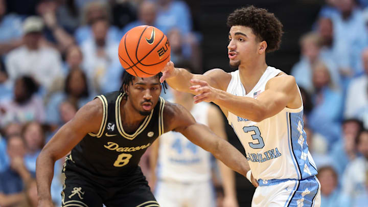 Jan 10, 2026; Chapel Hill, North Carolina, USA; North Carolina Tar Heels guard Derek Dixon (3) passes the ball against the Wake Forest Demon Deacons during the first half at Dean E. Smith Center. Mandatory Credit: Cory Knowlton-Imagn Images