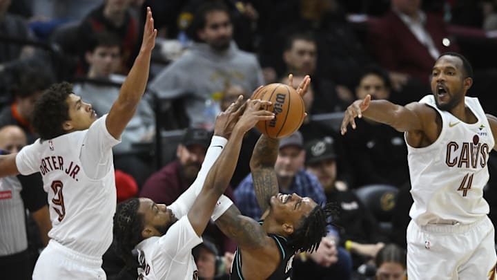 Dec 3, 2025; Cleveland, Ohio, USA; Portland Trail Blazers guard Caleb Love (2) shoots against Cleveland Cavaliers guard Craig Porter Jr. (9), guard Darius Garland (10) and center Evan Mobley (4) in the fourth quarter at Rocket Arena. Mandatory Credit: David Richard-Imagn Images Dec 3, 2025; Cleveland, Ohio, USA; Portland Trail Blazers guard Caleb Love (2) shoots against Cleveland Cavaliers guard Craig Porter Jr. (9), guard Darius Garland (10) and center Evan Mobley (4) in the fourth quarter at Rocket Arena. Mandatory Credit: David Richard-Imagn Images