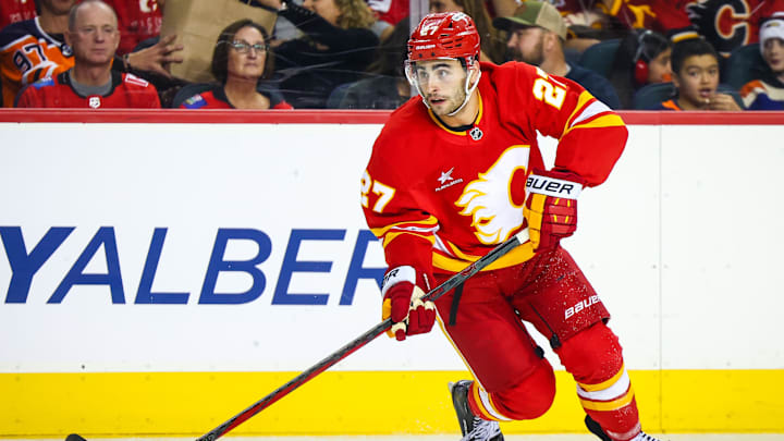 Nov 3, 2024; Calgary, Alberta, CAN; Calgary Flames right wing Matt Coronato (27) skates with the puck against the Edmonton Oilers during the second period at Scotiabank Saddledome. Mandatory Credit: Sergei Belski-Imagn Images