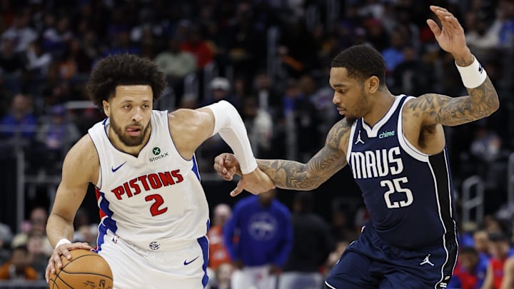 Jan 31, 2025; Detroit, Michigan, USA; Detroit Pistons guard Cade Cunningham (2) dribbles defended by Dallas Mavericks forward P.J. Washington (25) in the second half at Little Caesars Arena. Mandatory Credit: Rick Osentoski-Imagn Images Jan 31, 2025; Detroit, Michigan, USA; Detroit Pistons guard Cade Cunningham (2) dribbles defended by Dallas Mavericks forward P.J. Washington (25) in the second half at Little Caesars Arena. Mandatory Credit: Rick Osentoski-Imagn Images