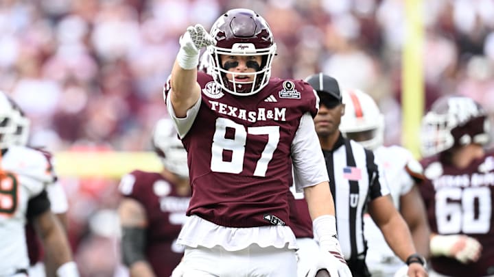 Dec 20, 2025; College Station, TX, USA; Texas A&M Aggies tight end Nate Boerkircher (87) celebrates a first down against the Miami Hurricanes during first quarter of the first round game of the CFP National Playoff at Kyle Field. Mandatory Credit: Maria Lysaker-Imagn Images