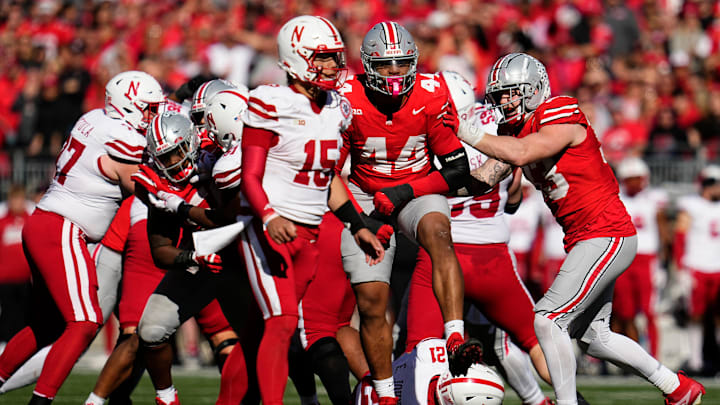 Ohio State Buckeyes defensive end JT Tuimoloau (44) celebrates a tackle of Nebraska Cornhuskers running back Emmett Johnson (21) during the second half of the NCAA football game at Ohio Stadium in Columbus on Saturday, Oct. 26, 2024. Ohio State won 21-17.