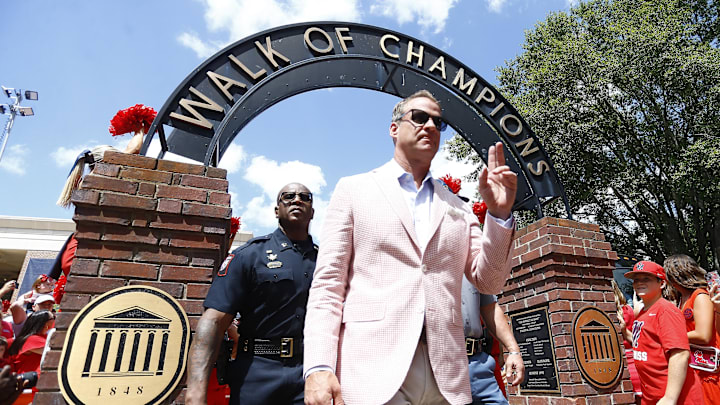 Sep 7, 2024; Oxford, Mississippi, USA; Mississippi Rebels head coach Lane Kiffin makes his makes his way down the Walk of Champions prior to the game against the Middle Tennessee Blue Raiders at Vaught-Hemingway Stadium. Mandatory Credit: Petre Thomas-Imagn Images