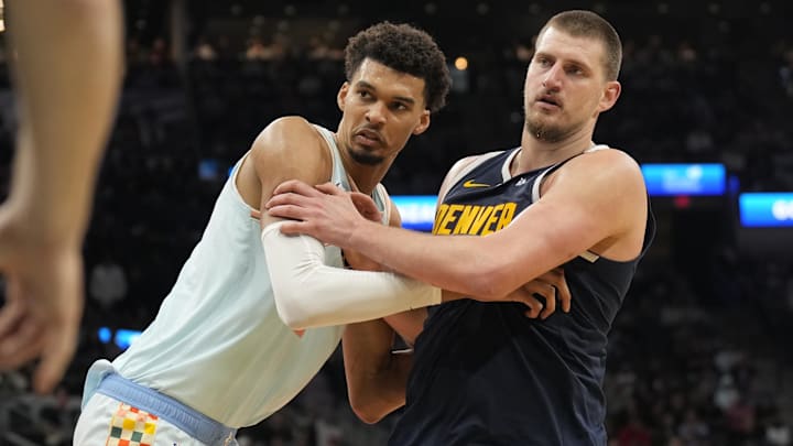 Jan 4, 2025; San Antonio, Texas, USA; San Antonio Spurs center Victor Wembanyama (1) and Denver Nuggets center Nikola Jokic (15) battle for position during an inbound pass in the second half at Frost Bank Center.