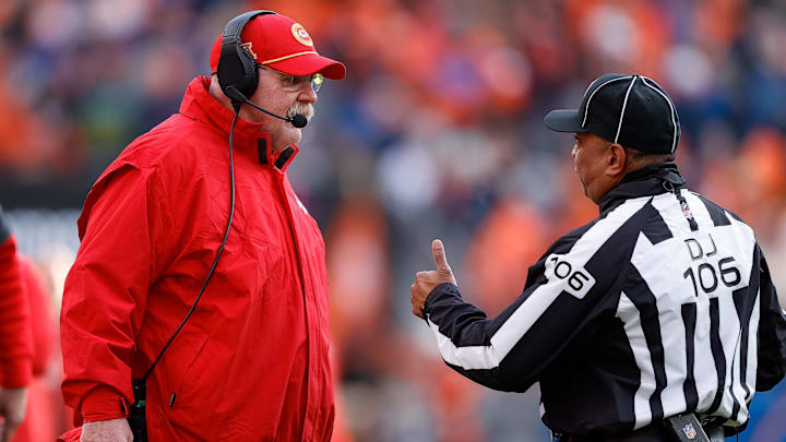 Jan 5, 2025; Denver, Colorado, USA; Kansas City Chiefs head coach Andy Reid talks with down judge Patrick Holt (106) after a play in the second quarter against the Denver Broncos at Empower Field at Mile High. Mandatory Credit: Isaiah J. Downing-Imagn Images