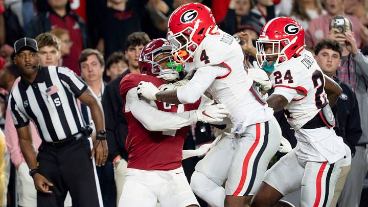 Oct 10, 2026; Tuscaloosa, Alabama, USA;  Georgia defensive back KJ Bolden (4) hits Alabama wide receiver Rico Scott (7) well before the ball arrives at Saban Field at Bryant-Denny Stadium. No penalty was called. Mandatory Credit: Gary Cosby Jr.-Imagn Images