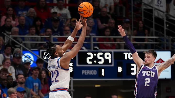 Jan 6, 2026; Lawrence, Kansas, USA; Kansas Jayhawks guard Darryn Peterson (22) shoots over TCU Horned Frogs guard Brock Harding (2) during the first half of the game at Allen Fieldhouse. Mandatory Credit: Denny Medley-Imagn Images