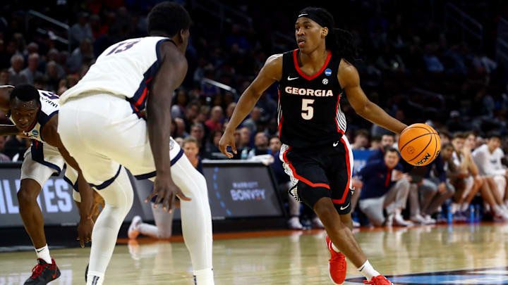 Mar 20, 2025; Wichita, KS, USA; Georgia Bulldogs guard Silas Demary Jr. (5) dribbles against Gonzaga Bulldogs forward Graham Ike (13) in the second half of a first round men’s NCAA Tournament game at Intrust Bank Arena. Mandatory Credit: Nick Tre. Smith-Imagn Images Mar 20, 2025; Wichita, KS, USA; Georgia Bulldogs guard Silas Demary Jr. (5) dribbles against Gonzaga Bulldogs forward Graham Ike (13) in the second half of a first round men’s NCAA Tournament game at Intrust Bank Arena. Mandatory Credit: Nick Tre. Smith-Imagn Images