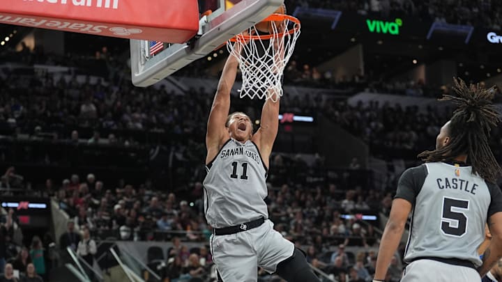 Feb 7, 2026; San Antonio, Texas, USA;  San Antonio Spurs forward Carter Bryant (11) dunks in the first half against the Dallas Mavericks at Frost Bank Center. Mandatory Credit: Daniel Dunn-Imagn Images