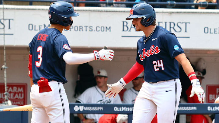 May 31, 2025; Oxford, MS, USA; Mississippi Rebels catcher Austin Fawley (24) reacts with shortstop Luke Cheng (3)  after a home run during the second inning against the Western Kentucky Hilltoppers. Mandatory Credit: Petre Thomas-Imagn Images