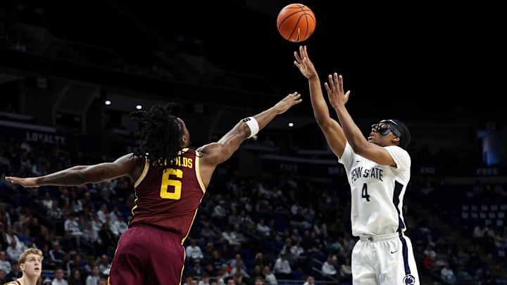 Penn State Nittany Lions guard Kayden Mingo (4) shoots the ball as Minnesota Golden Gophers guard Langston Reynolds (6) defends during the first half at Bryce Jordan Center. Mandatory Credit: Matthew O'Haren-Imagn Images