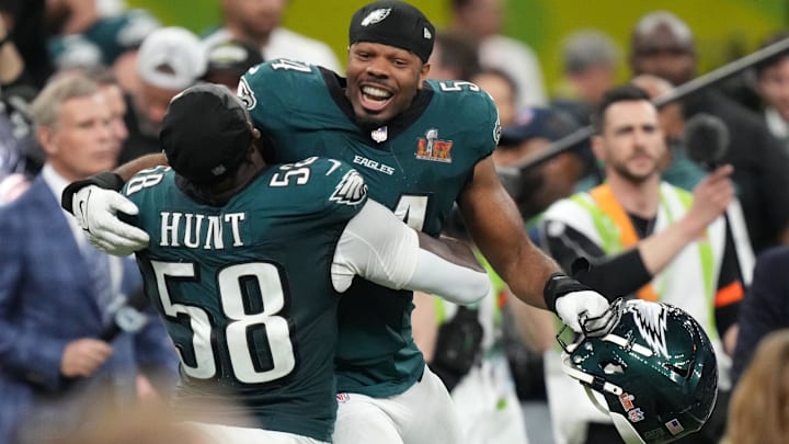 Feb 9, 2025; New Orleans, LA, USA; Philadelphia Eagles linebacker Jeremiah Trotter Jr. (54) reacts with linebacker Jalyx Hunt (58) after defeating the Kansas City Chiefs in Super Bowl LIX at Caesars Superdome. 