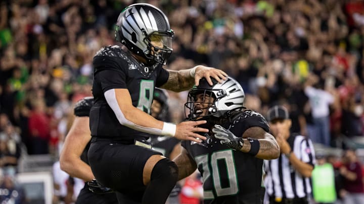 Oregon Ducks quarterback Dillon Gabriel and Oregon Ducks running back Jordan James