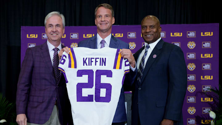 Dec 1, 2025; Baton Rouge, LA, USA; LSU president Wade Rousse, left, LSU new head coach Lane Kiffin and LSU athletic director Verge Ausberry stand together at South Stadium Club at Tiger Stadium. Mandatory Credit: Matthew Hinton-Imagn Images Dec 1, 2025; Baton Rouge, LA, USA; LSU president Wade Rousse, left, LSU new head coach Lane Kiffin and LSU athletic director Verge Ausberry stand together at South Stadium Club at Tiger Stadium. Mandatory Credit: Matthew Hinton-Imagn Images