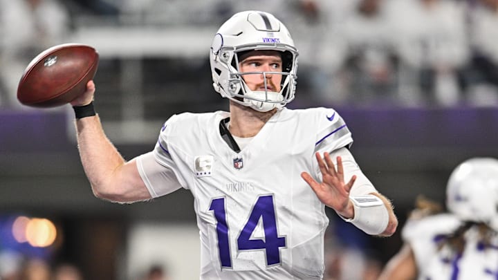 Dec 16, 2024; Minneapolis, Minnesota, USA; Minnesota Vikings quarterback Sam Darnold (14) throws a pass against the Chicago Bears during the third quarter at U.S. Bank Stadium. Mandatory Credit: Jeffrey Becker-Imagn Images