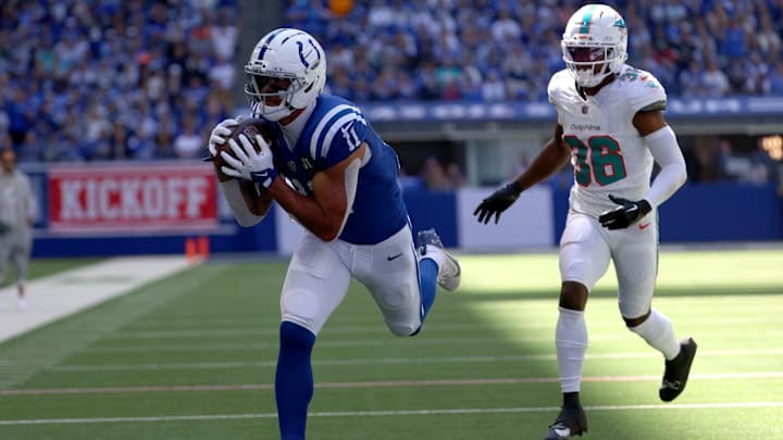 Sep 7, 2025; Indianapolis, Indiana, USA; Indianapolis Colts wide receiver Michael Pittman Jr. (11) catches a touchdown against Miami Dolphins cornerback Storm Duck (36) during the first half at Lucas Oil Stadium. Mandatory Credit: Trevor Ruszkowski-Imagn Images Sep 7, 2025; Indianapolis, Indiana, USA; Indianapolis Colts wide receiver Michael Pittman Jr. (11) catches a touchdown against Miami Dolphins cornerback Storm Duck (36) during the first half at Lucas Oil Stadium. Mandatory Credit: Trevor Ruszkowski-Imagn Images