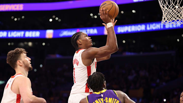 Mar 31, 2025; Los Angeles, California, USA;  Houston Rockets forward Amen Thompson (1) goes to the basket against Los Angeles Lakers forward Dorian Finney-Smith (17) during the fourth quarter at Crypto.com Arena. Mandatory Credit: Kiyoshi Mio-Imagn Images