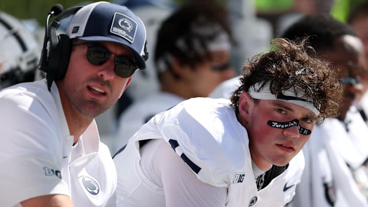 Penn State Nittany Lions quarterback Drew Allar (right) sits with quarterbacks coach Danny O'Brien during the game vs. the UCLA Bruins at the Rose Bowl.