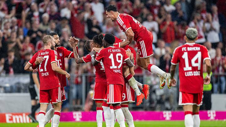 Bayern Munich players celebrating a goal against VfB Stuttgart.
