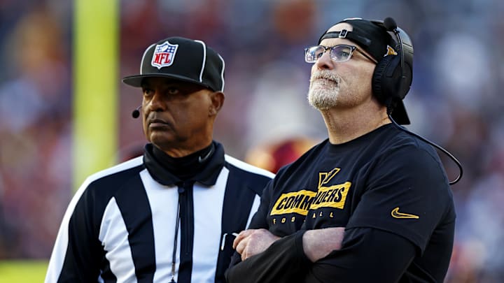Quinn watches a replay on the video board during the third quarter against the Cowboys.