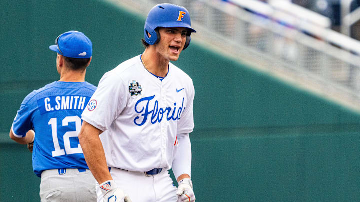 Jun 19, 2024; Omaha, NE, USA; Florida Gators first baseman Jac Caglianone (14) reacts after hitting a double against the Kentucky Wildcats during the first inning at Charles Schwab Field Omaha. Mandatory Credit: Dylan Widger-Imagn Images