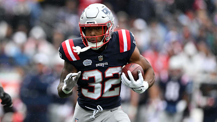 Sep 7, 2025; Foxborough, Massachusetts, USA; New England Patriots running back TreVeyon Henderson (32) rushes the ball against the Las Vegas Raiders in the first half at Gillette Stadium. Mandatory Credit: Brian Fluharty-Imagn Images