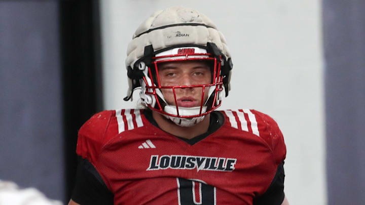 Louisville’s Ashton Gillotte warms up for Spring Practice on Thursday.
April 4, 2024
