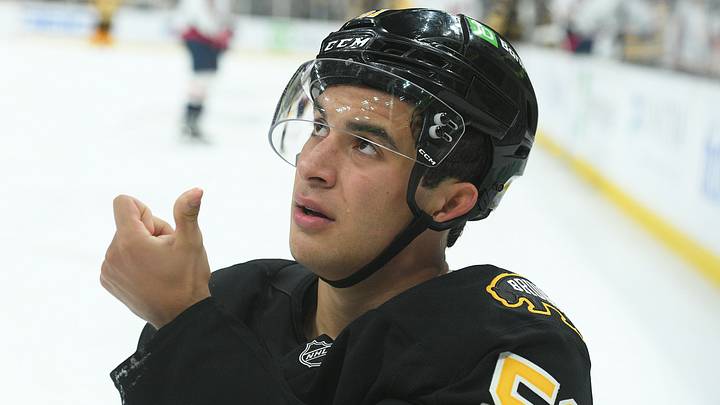 Sep 21, 2025; Boston, Massachusetts, USA; Boston Bruins center Matthew Poitras (51) shows the official blood from his mouth after getting hit in the mouth during the third period against the Washington Capitals at TD Garden. Mandatory Credit: Bob DeChiara-Imagn Images Sep 21, 2025; Boston, Massachusetts, USA; Boston Bruins center Matthew Poitras (51) shows the official blood from his mouth after getting hit in the mouth during the third period against the Washington Capitals at TD Garden. Mandatory Credit: Bob DeChiara-Imagn Images