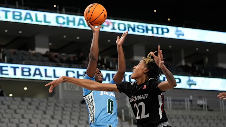 Mar 6, 2023; Fort Worth, TX, USA; Tulane Green Wave guard Kyren Whittington (0) shoots against Cincinnati Bearcats forward Malea Williams (22) during the second half at Dickies Arena. 