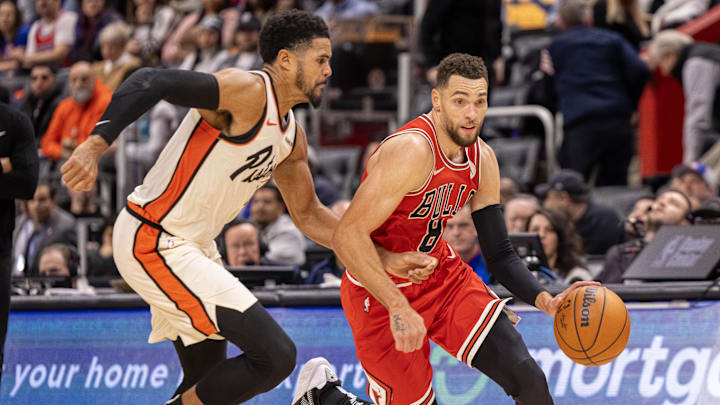 Nov 18, 2024; Detroit, Michigan, USA; Detroit Pistons forward Tobias Harris (12) defends against Chicago Bulls guard Zach LaVine (8) during the second half at Little Caesars Arena. Mandatory Credit: David Reginek-Imagn Images