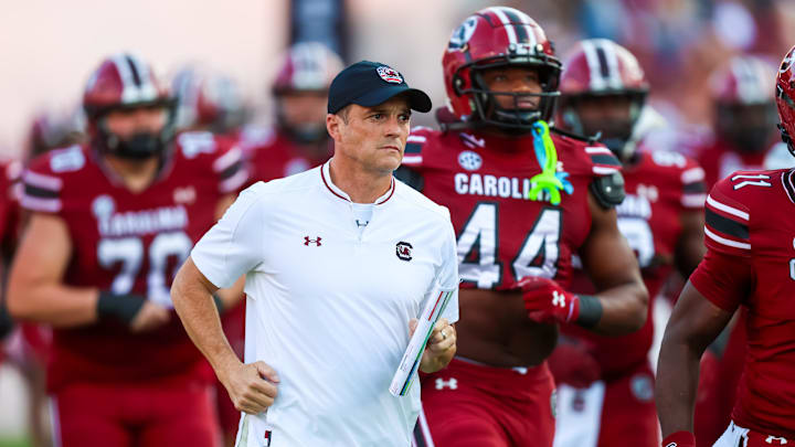 Nov 22, 2025; Columbia, South Carolina, USA; South Carolina Gamecocks head coach Shane Beamer leads his team onto the field before their game against the Coastal Carolina Chanticleers at Williams-Brice Stadium. Mandatory Credit: Jeff Blake-Imagn Images