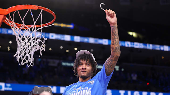 Mar 7, 2025; Memphis, Tennessee, USA; Memphis Tigers guard PJ Haggerty (4) cuts the net after winning the game against the South Florida Bulls at FedExForum. Mandatory Credit: Wesley Hale-Imagn Images Mar 7, 2025; Memphis, Tennessee, USA; Memphis Tigers guard PJ Haggerty (4) cuts the net after winning the game against the South Florida Bulls at FedExForum. Mandatory Credit: Wesley Hale-Imagn Images
