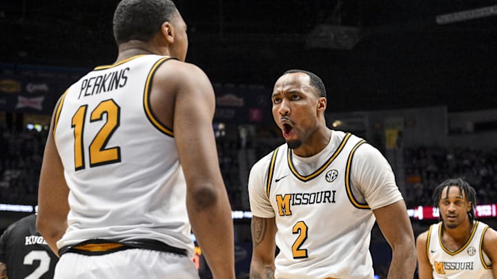 Mar 13, 2025; Nashville, TN, USA;  Missouri Tigers guard Tamar Bates (2) celebrates the foul with guard Tony Perkins (12) against the Mississippi State Bulldogs during the second half at Bridgestone Arena. Mandatory Credit: Steve Roberts-Imagn Images