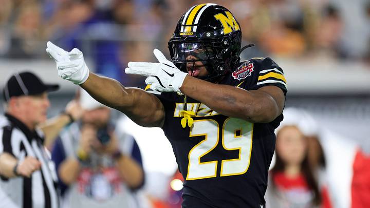 Missouri Tigers running back Ahmad Hardy reacts to his first down pickup during the first quarter of the TaxSlayer Gator Bowl Missouri Tigers running back Ahmad Hardy reacts to his first down pickup during the first quarter of the TaxSlayer Gator Bowl