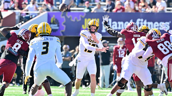 Oct 12, 2024; Amherst, Massachusetts, USA; Missouri Tigers quarterback Brady Cook (12)  throws a pass to wide receiver Luther Burden III (3) during the first half against the Massachusetts Minutemen at Warren McGuirk Alumni Stadium. Mandatory Credit: Eric Canha-Imagn Images