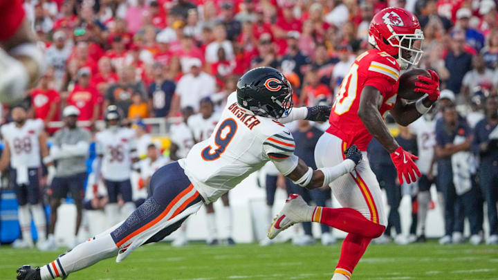 Brasard Smith makes a catch in the middle of the field against Bears safety Jaquan Brisker in Friday night's preseason finale.