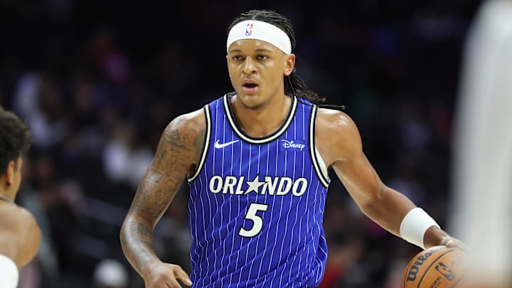 Oct 10, 2025; Philadelphia, Pennsylvania, USA; Orlando Magic forward Paolo Banchero (5) dribbles the ball against the Philadelphia 76ers during the third quarter at Xfinity Mobile Arena. Mandatory Credit: Bill Streicher-Imagn Images Oct 10, 2025; Philadelphia, Pennsylvania, USA; Orlando Magic forward Paolo Banchero (5) dribbles the ball against the Philadelphia 76ers during the third quarter at Xfinity Mobile Arena. Mandatory Credit: Bill Streicher-Imagn Images
