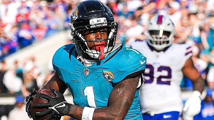Jacksonville Jaguars running back Travis Etienne Jr. (1) runs towards the end zone during the fourth quarter in an NFL football AFC Wild Card playoff matchup, Sunday, Jan. 11, 2026, in Jacksonville, Fla. Bills lead 10-7 at the half over the Jaguars. The Bills defeated the Jaguars 27-24. [Doug Engle/Florida Times-Union]