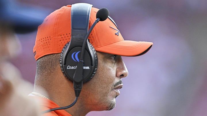 Oct 4, 2025; Louisville, Kentucky, USA; Virginia Cavaliers head coach Tony Elliott watches from the sideline during the second half against the Louisville Cardinals at L&N Federal Credit Union Stadium. Virginia defeated Louisville 30-27. Mandatory Credit: Jamie Rhodes-Imagn Images
