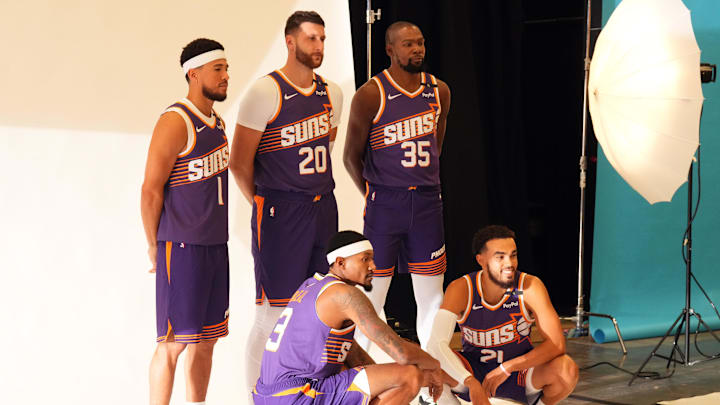 Sep 30, 2024; Phoenix, AZ, USA; Phoenix Suns guard Devin Booker (1) and Phoenix Suns center Jusuf Nurkic (20) and Phoenix Suns forward Kevin Durant (35) and Phoenix Suns guard Bradley Beal (3) and Phoenix Suns guard Tyus Jones (21) pose for a photo during Media Day at Footprint Center. Mandatory Credit: Joe Camporeale-Imagn Images