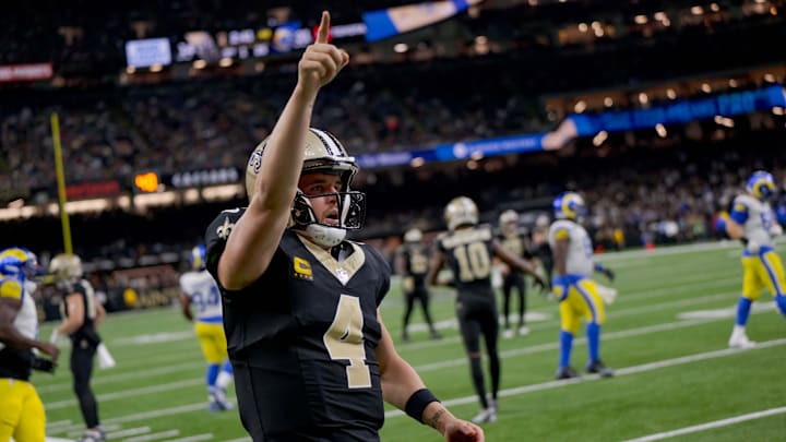 Dec 1, 2024; New Orleans, Louisiana, USA; New Orleans Saints quarterback Derek Carr (4) reacts after rushing for a first down against the Los Angeles Rams during the fourth quarter at Caesars Superdome. Mandatory Credit: Matthew Hinton-Imagn Images