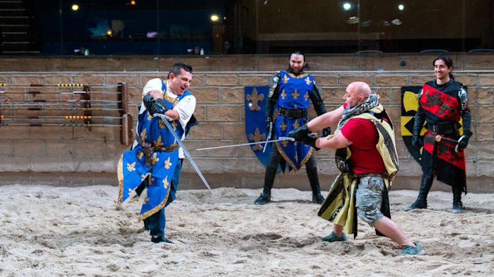 Buddy Valastro and Duff Goldman with Medieval Times cast members, as seen on Buddy vs Duff, Season 2. photo provided by Food Network