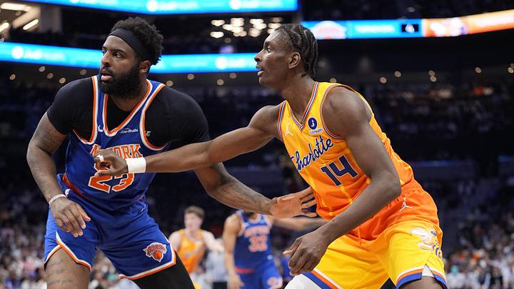 Charlotte Hornets forward Moussa Diabaté (14) looks for the pass defended by New York Knicks center/forward Mitchell Robinson Charlotte Hornets forward Moussa Diabaté (14) looks for the pass defended by New York Knicks center/forward Mitchell Robinson