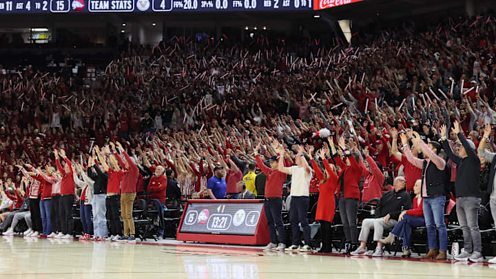 Jan 20, 2026; Fayetteville, Arkansas, USA; Arkansas Razorbacks fans cheer during the first half against the Vanderbilt Commodores at Bud Walton Arena. Mandatory Credit: Nelson Chenault-Imagn Images Jan 20, 2026; Fayetteville, Arkansas, USA; Arkansas Razorbacks fans cheer during the first half against the Vanderbilt Commodores at Bud Walton Arena. Mandatory Credit: Nelson Chenault-Imagn Images