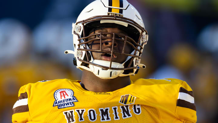 Dec 30, 2022; Tucson, AZ, USA; Wyoming Cowboys guard Emmanuel Pregnon (76) against the Ohio Bobcats during the 2022 Barstool Sports Arizona Bowl at Arizona Stadium. 