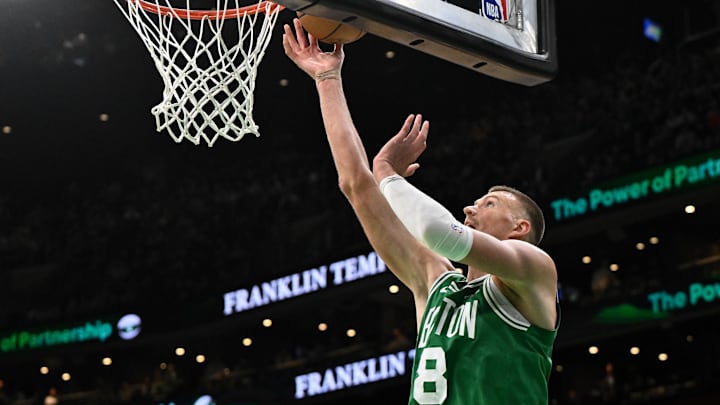Dec 4, 2024; Boston, Massachusetts, USA; Boston Celtics center Kristaps Porzingis (8) attempts a layup against the Detroit Pistons during the fourth quarter at the TD Garden. Mandatory Credit: Brian Fluharty-Imagn Images Dec 4, 2024; Boston, Massachusetts, USA; Boston Celtics center Kristaps Porzingis (8) attempts a layup against the Detroit Pistons during the fourth quarter at the TD Garden. Mandatory Credit: Brian Fluharty-Imagn Images
