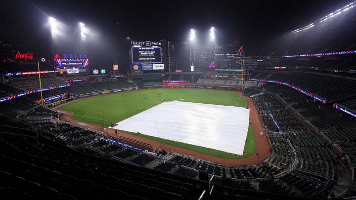 Jun 16, 2026; Atlanta, Georgia, USA; The tarp sits on the field during a game between the Atlanta Braves and San Francisco Giants in the second inning at Truist Park. The game was postponed due to weather. Mandatory Credit: Brett Davis-Imagn Images