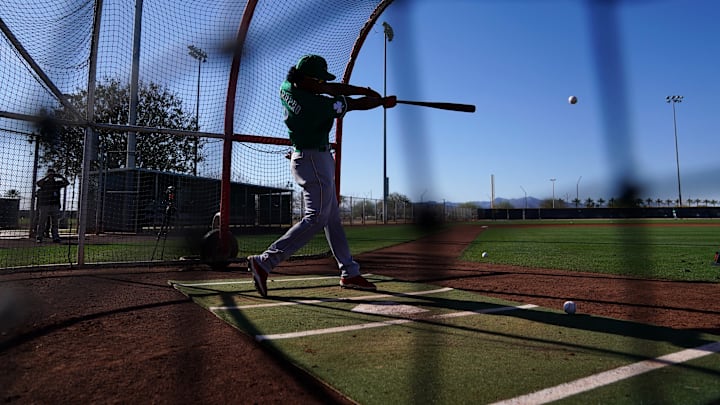 Cincinnati Reds infielder Jose Barrero (2) takes a swing during batting practice.